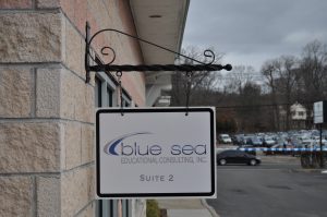 Long Island Wayfinding Signs outdoor hanging blade sign blue sea building business wayfinding address sign 300x199